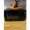 Image 1 : This is a COMFEE' CM-M201K(BK) Countertop Microwave Oven. 
It has 700W of power.
It has a 20L capaci