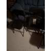 Image 3 : Four folding chairs including two with black metal frames and vinyl seats and two with black metal f