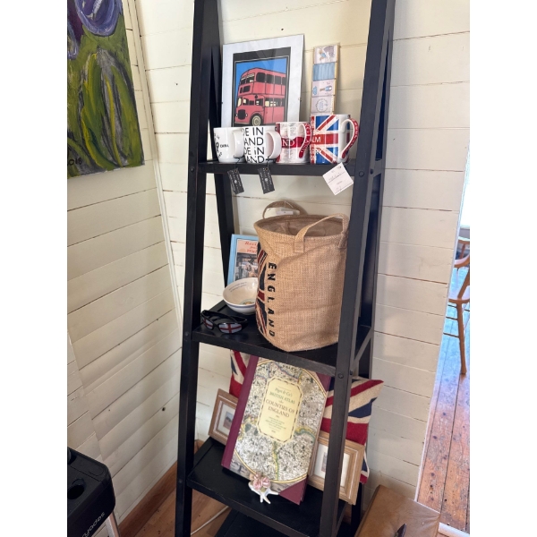  Linon Acadia black wood ladder bookcase featuring five shelves for ample storage. 