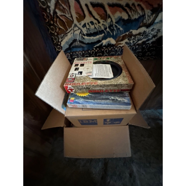 , boxes of brand new books, and couple of board games, roulette board game, wooden ships game.