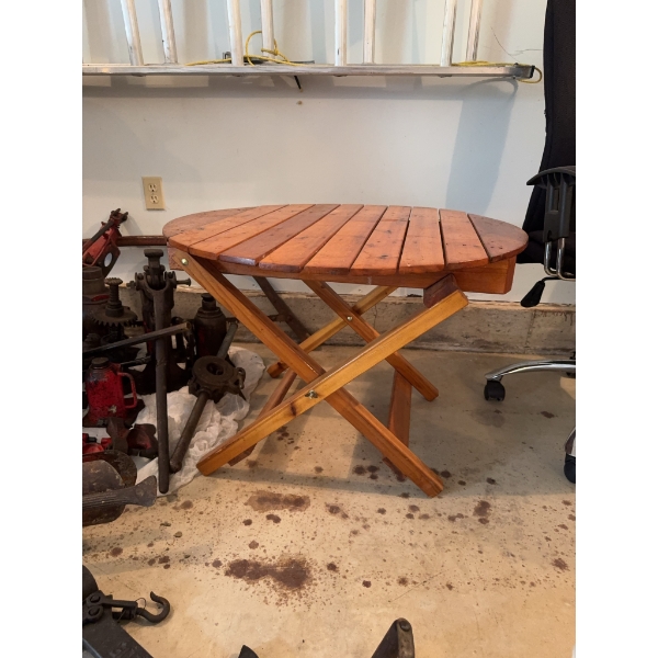 Round folding table made of wood, measuring approximately 32 inches in diameter and 28 inches in hei