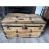 Image 4 : Wood and metal steamer trunk with exterior metal hardware and wooden slats. The exterior surface sho