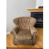 Image 2 :  traditional-style armchair featuring a tufted wingback design, rolled arms, and decorative nailhead