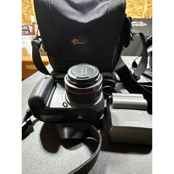 Canon PowerShot Pro 8.O megapixels, seven times optical zoom with Canon battery charger .