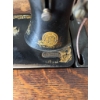 Image 15 : Singer treadle sewing machine, serial number 16165557, featuring original cast iron base and wooden 