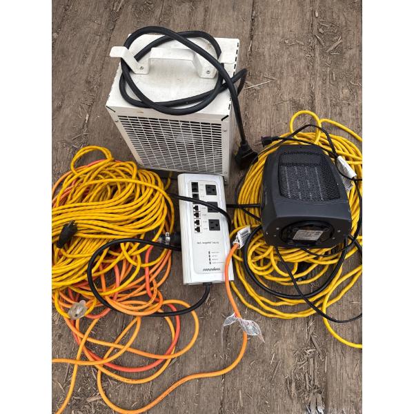 Space heaters and extension cords. Three different sets of very long extension cords.