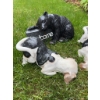 Image 3 : Three animal garden statues: one black bear holding a 'Welcome' sign and two black and white dog fig