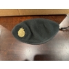 Image 1 :  collectible Royal Canadian Navy green beret featuring a distinct metal badge. 