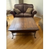 Image 2 :  Rustic wooden coffee table featuring a hinged top for storage and metal accents.   
