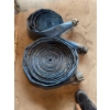 Image 2 : Lot consists of two blue layflat water hoses with attached metal couplings. The hoses are coiled and