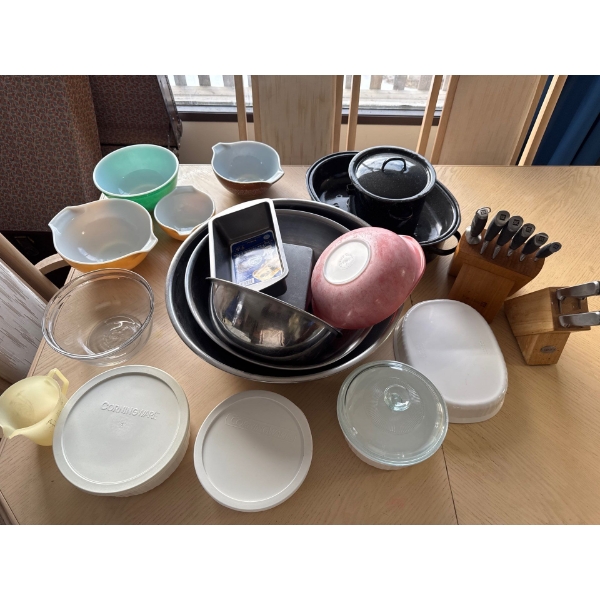 Corningware, Pyrex, stainless dishes, roaster pans, and knife set.