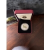 Image 2 : a 2014 25-cent coloured and glow-in-the-dark coin from the Royal Canadian Mint featuring the prehist