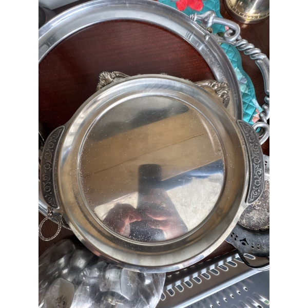 vintage serving tray featuring an ornate, raised shell and scroll design along the bor