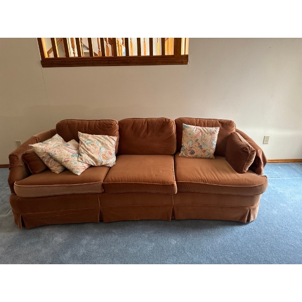 terracotta-colored velvet or suede 3-seater sofa couch