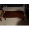 Image 3 : Rectangular wooden coffee table featuring a decorative brass-style drawer pull on the front and cabr