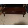 Image 2 : Rectangular wooden coffee table featuring a decorative brass-style drawer pull on the front and cabr