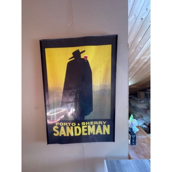 This item is a framed reproduction print of the iconic 1931 "Porto & Sherry Sandeman" vintage advert