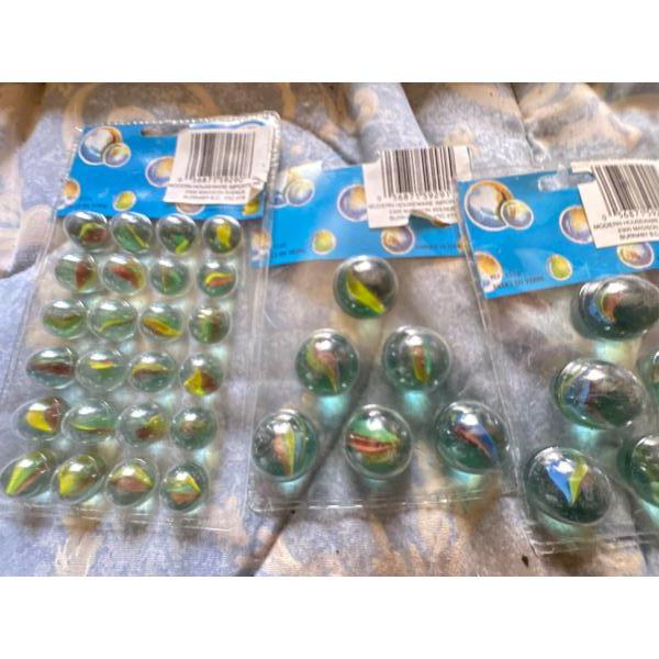 They are a traditional machine-made marble design with multiple colored vanes trapped inside clear g