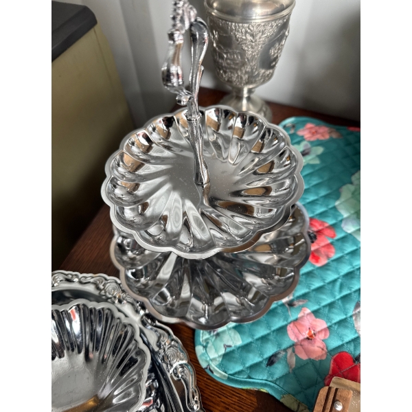 vintage two-tiered serving tray or cake stand featuring a distinctive scalloped, swirl design patter