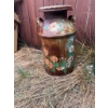 Image 1 : Two metal milk cans. One is decorated with hand-painted flower designs, and the other is solid green