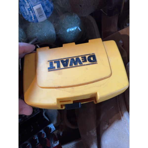 DeWalt screwdriver bit set in yellow case, a metal drill bit set in red case, a torque wrench, and v