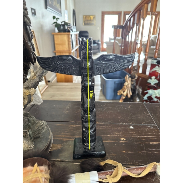 vintage Boma Canada resin totem pole figurine, often produced as a souvenir or collectible reproduct