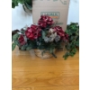 Image 5 :  various artificial plants and floral arrangements in baskets, which are commonly used for seasonal 