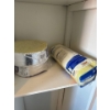 Image 2 : Miscellaneous items in the right cabinet of the laundry room, items include spray paint, pant, paint