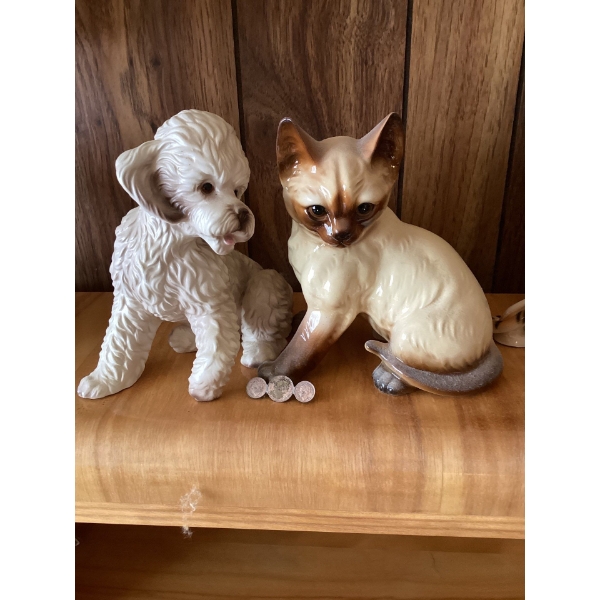 Coin pin and These are vintage ceramic figurines of a white poodle and a Siamese cat. 
The poodle fi