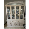 Image 1 : This is a lighted China or curio cabinet designed to display possessions. 

