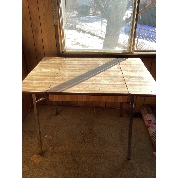 Folding wood table. 29 and a half deep by 41 and a half long by 29 high.