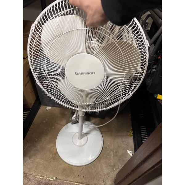 This is a Garrison 16" oscillating pedestal fan. 
It is white in color.
It features three-speed sett