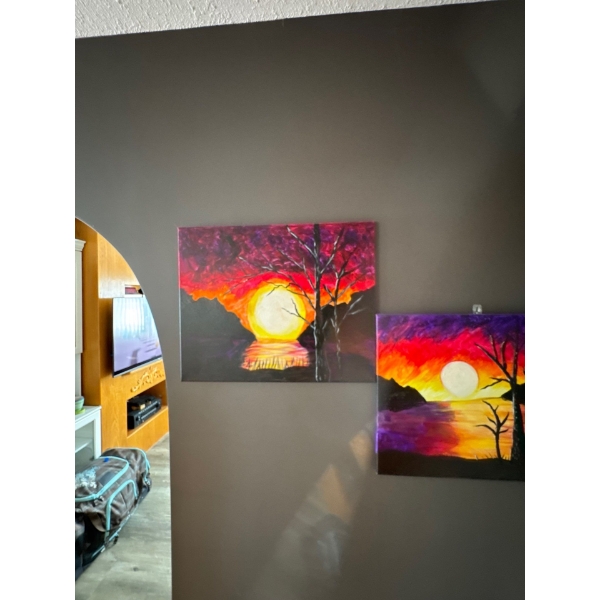 two acrylic paintings featuring vibrant sunset landscape scenes with trees and reflections on wate
