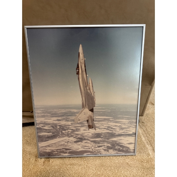 A framed flying fighter jet