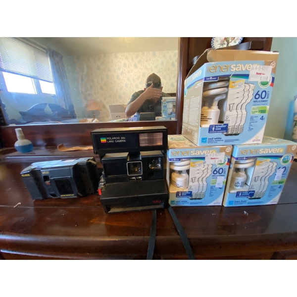Polaroid 600 land camera 640 in a Kodak VR 35 camera and three boxes of energy saver brand new in th