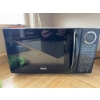 Image 1 : RCA brand microwave oven in black finish. Features digital control panel and turntable. Includes pre