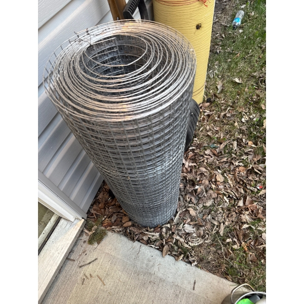 Large roll of wire mesh, roughly three and a half ft tall