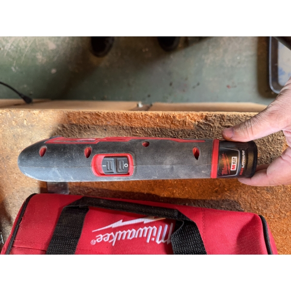 Milwaukee M12 cordless multi-tool with 12V Lithium-Ion battery, charger, and Milwaukee branded carry