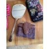 Image 2 : Small brown and purple snakeskin print wallet with a clasp closure.Vintage hand mirror, likely part 