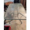 Image 6 : One rectangular glass-top patio table with a central umbrella hole and a metal frame, along with six