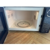 Image 5 : RCA brand microwave oven in black finish. Features digital control panel and turntable. Includes pre
