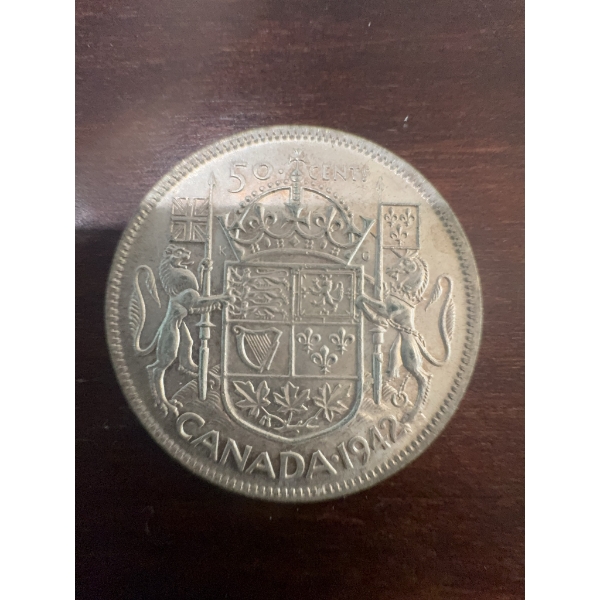 1947 Canadian 50 cents coin featuring King George VI on the obverse and Canada's coat of arms on the