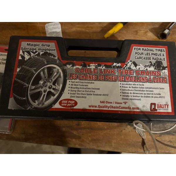 A pair of Quality Chain Canada Magic Grip cable link tire chains brand new in box designed for 
Feat
