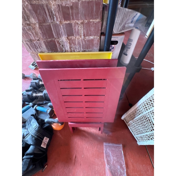 Three plastic folding tables in different colors.