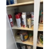 Image 1 : Miscellaneous items in the right cabinet of the laundry room, items include spray paint, pant, paint