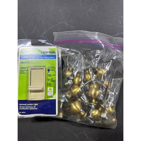 Brass hardware for cabinets and Leviton slide dimmer with preset.