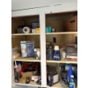 Image 1 : All items in left cabinet in laundry room, items include Bissell cleaner, tin foil, lightbulbs and e
