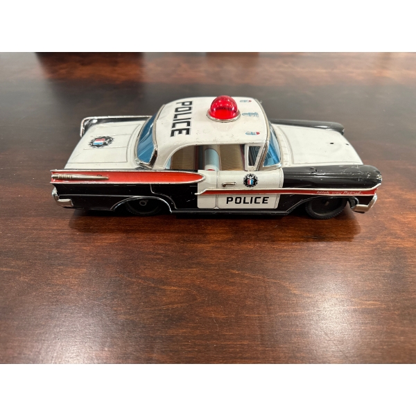  Vintage tin litho 1958 Mercury Police Car toy, likely manufactured in Japan by companies like Yonez