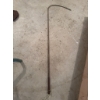 Image 1 : This item is a metal hay or bale hook featuring a straight metal shaft ending in a curved hook and a