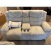 Image 1 : This is a corduroy reclining loveseat with a center console and cup holders.